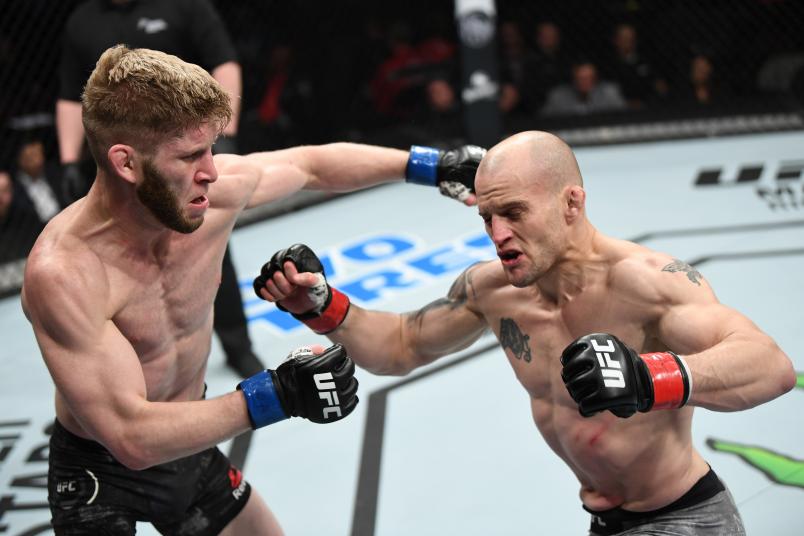 OTTAWA, ON - MAY 04: (L-R) Cole Smith of Canada punches Mitch Gagnon of Canada in their bantamweight bout during the UFC Fight Night event at Canadian Tire Centre on May 4, 2019 in Ottawa, Ontario, Canada. (Photo by Jeff Bottari/Zuffa LLC)
