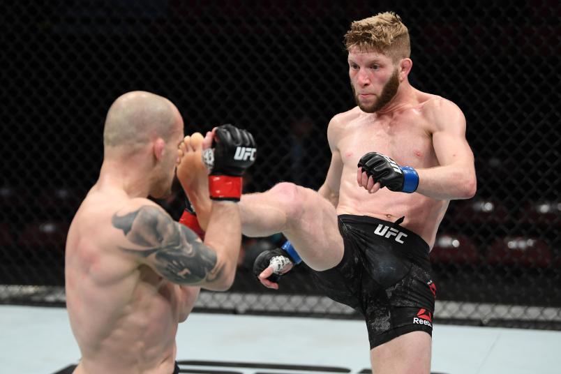 OTTAWA, ON - MAY 04: (R-L) Cole Smith of Canada kicks Mitch Gagnon of Canada in their bantamweight bout during the UFC Fight Night event at Canadian Tire Centre on May 4, 2019 in Ottawa, Ontario, Canada. (Photo by Jeff Bottari/Zuffa LLC)