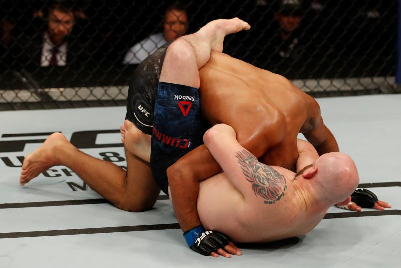 ROCHESTER, NY - MAY 18: (R-L) Zak Cummings secures a guillotine choke submission against Trevin Giles in their middleweight bout during the UFC Fight Night event at Blue Cross Arena on May 18, 2019 in Rochester, New York. (Photo by Michael Owens/Zuffa LLC via Getty Images)