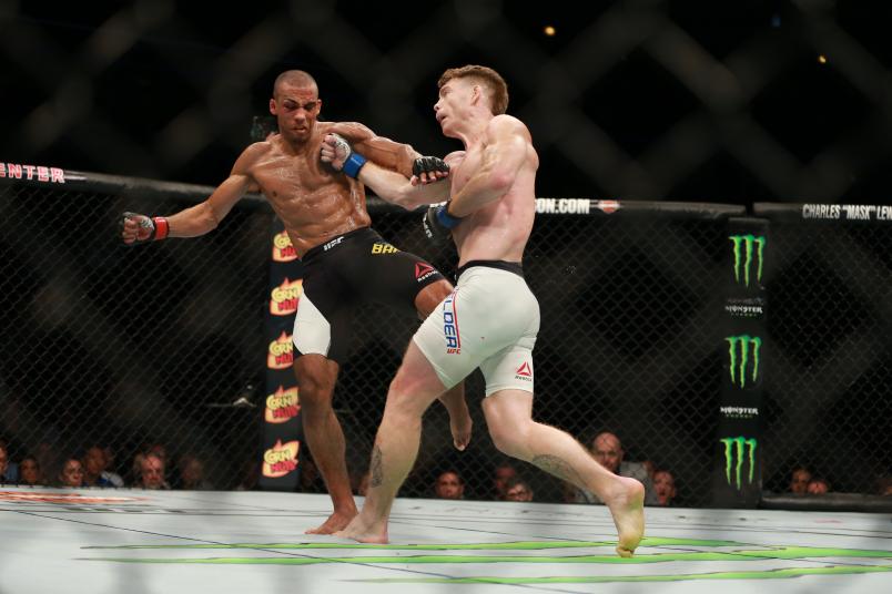 Edson Barboza punches Paul Felder in their lightweight bout during the UFC event at the United Center on July 25, 2015 in Chicago, Illinois. (Photo by Rey Del Rio/Zuffa LLC/Zuffa LLC via Getty Images)