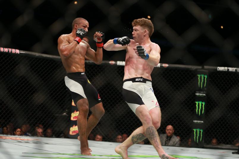 CHICAGO, IL - JULY 25: Paul Felder punches Edson Barboza in their lightweight bout during the UFC event at the United Center on July 25, 2015 in Chicago, Illinois. (Photo by Rey Del Rio/Zuffa LLC)