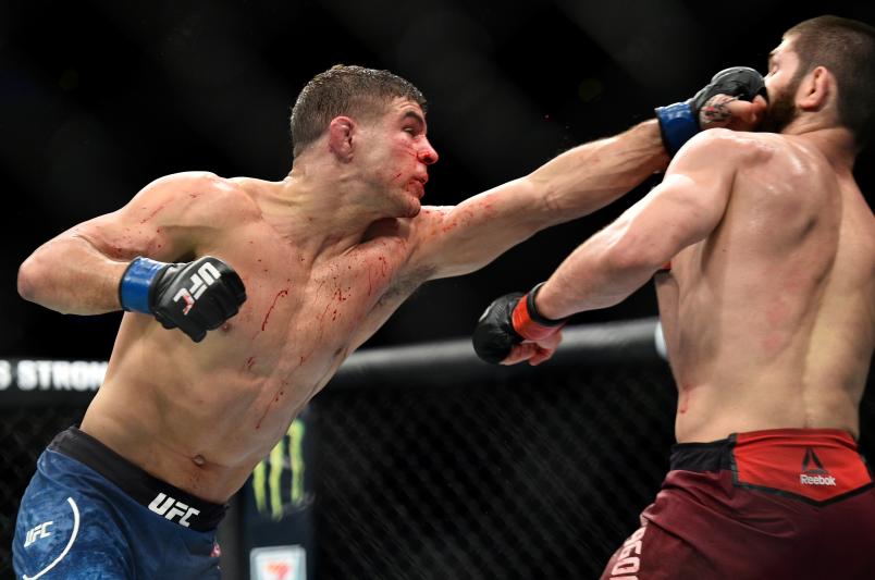 BROOKLYN, NEW YORK - APRIL 07: (L-R) Al Iaquinta punches Khabib Nurmagomedov of Russia in their lightweight title bout during the UFC 223 event inside Barclays Center on April 7, 2018 in Brooklyn, New York. (Photo by Brandon Magnus/Zuffa LLC/Zuffa LLC via Getty Images)