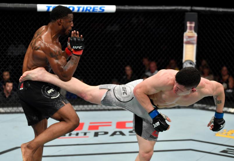 SACRAMENTO, CALIFORNIA - JULY 13: (R-L) Wellington Turman kicks Karl Roberson in their middleweight bout during the UFC Fight Night event at Golden 1 Center on July 13, 2019 in Sacramento, California. (Photo by Jeff Bottari/Zuffa LLC)