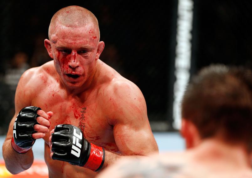 MONTREAL, QC - NOVEMBER 17: Georges St-Pierre (L) fights against Carlos Condit in their welterweight title bout during UFC 154 on November 17, 2012 at the Bell Centre in Montreal, Canada. (Photo by Josh Hedges/Zuffa LLC/Zuffa LLC via Getty Images)