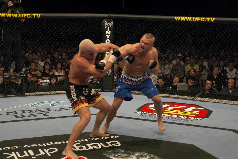 Chuck Liddell punches Tito Ortiz during their light heavyweight championship bout at UFC 47 inside the Mandalay Bay Events Center on April 2, 2004 in Las Vegas, Nevada. (Photo by Josh Hedges/Zuffa LLC via Getty Images)