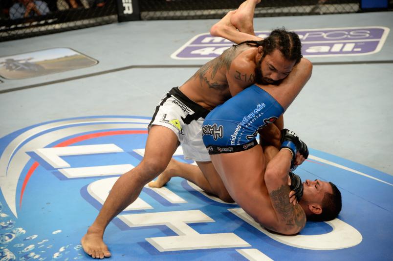 MILWAUKEE, WI - AUGUST 31: (R-L) Anthony Pettis attempts to submit Benson Henderson in their UFC lightweight championship bout at BMO Harris Bradley Center on August 31, 2013 in Milwaukee, Wisconsin. (Photo by Jeff Bottari/Zuffa LLC/Zuffa LLC via Getty Images)