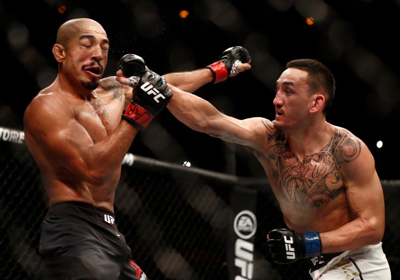 Max Holloway punches Jose Aldo of Brazil in their UFC featherweight championship bout during the UFC 212 event at Jeunesse Arena on June 3, 2017 in Rio de Janeiro, Brazil. (Photo by Buda Mendes/Zuffa LLC via Getty Images)