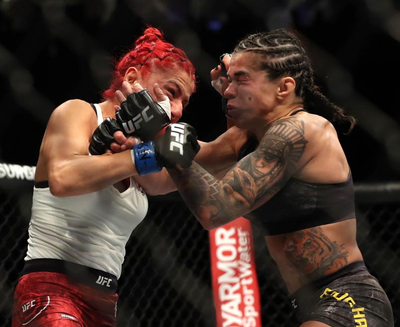 Claudia Gadelha of Brazil (right) punches Randa Markos of Iraq during their UFC 239 Women’s Strawweight bout at T-Mobile Arena on July 06, 2019 in Las Vegas, Nevada. (Photo by Sean M. Haffey/Getty Images)