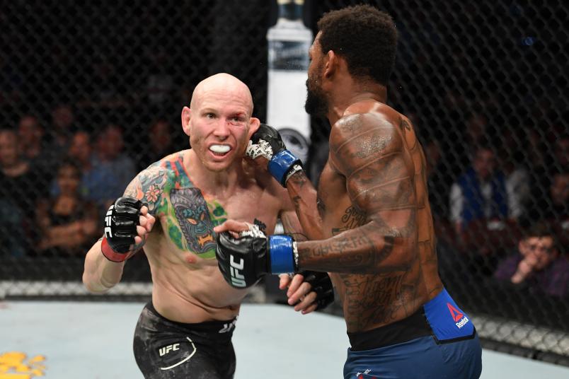 Michael Johnson punches Josh Emmett in their featherweight bout during the UFC Fight Night event at Wells Fargo Center on March 30, 2019 in Philadelphia, Pennsylvania. (Photo by Josh Hedges/Zuffa LLC via Getty Images)