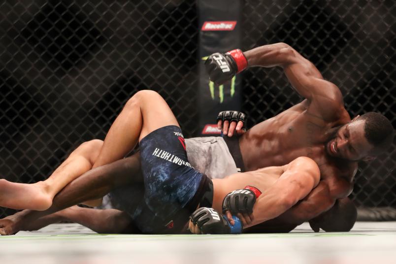 ATLANTA, GA - APRIL 13: Montel Jackson punches Andre Soukhamthath in their bantamweight bout during the UFC 236 event at State Farm Arena on April 13, 2019 in Atlanta, Georgia. (Photo by Carmen Mandato/Zuffa LLC via Getty Images)