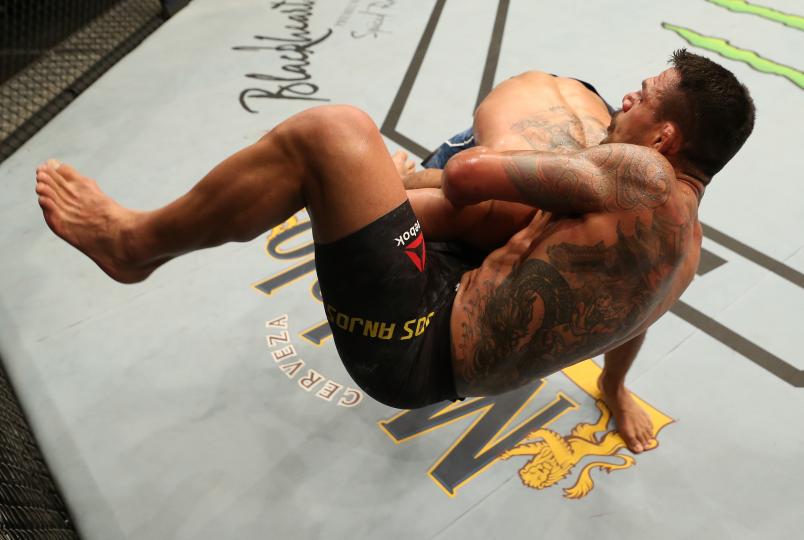 ROCHESTER, NY - MAY 18: (R-L) Kevin Lee takes down Rafael Dos Anjos of Brazil in their welterweight bout during the UFC Fight Night event at Blue Cross Arena on May 18, 2019 in Rochester, New York. (Photo by Michael Owens/Zuffa LLC/Zuffa LLC via Getty Images)