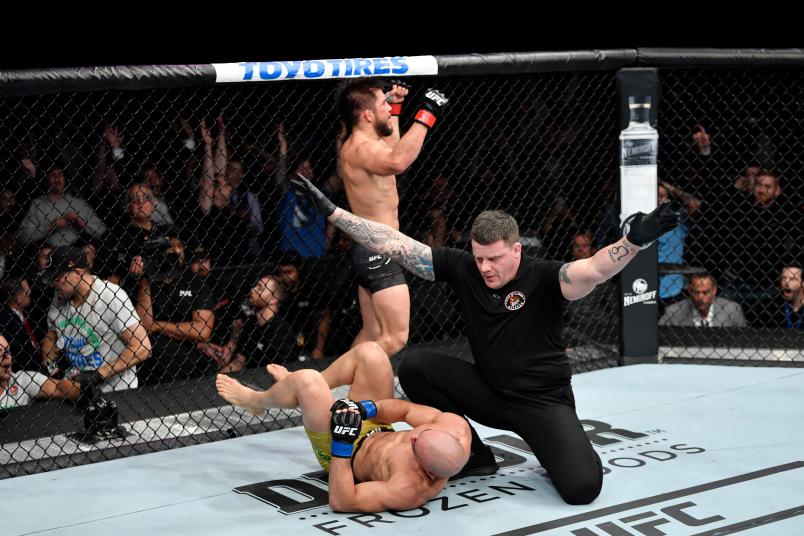 Henry Cejudo celebrates his victory over Marlon Moraes of Brazil in their bantamweight championship bout during the UFC 238 event at the United Center on June 8, 2019 in Chicago, Illinois. (Photo by Jeff Bottari/Zuffa LLC via Getty Images)