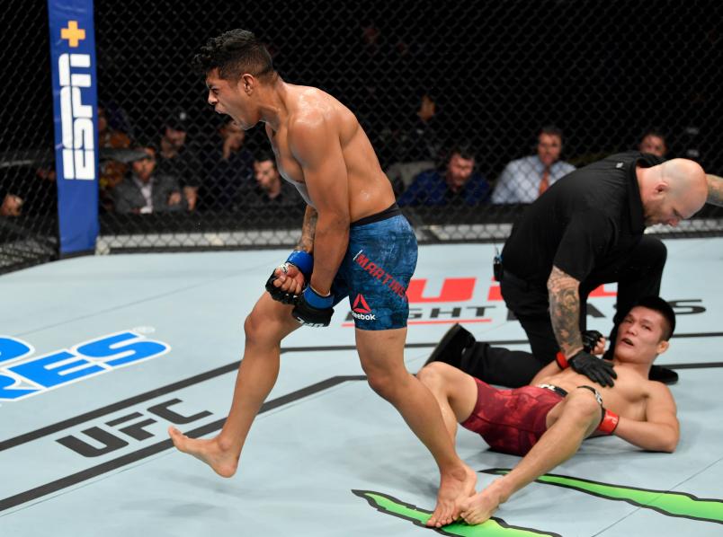 SACRAMENTO, CALIFORNIA - JULY 13: Jonathan Martinez celebrates after knocking out Liu Pingyuan of China in their bantamweight bout during the UFC Fight Night event at Golden 1 Center on July 13, 2019 in Sacramento, California. (Photo by Jeff Bottari/Zuffa LLC/Zuffa LLC via Getty Images)