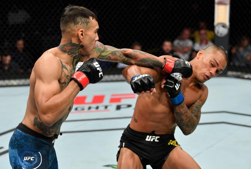 SACRAMENTO, CALIFORNIA - JULY 13: (L-R) Andre Fili punches Sheymon Moraes of Brazil in their featherweight bout during the UFC Fight Night event at Golden 1 Center on July 13, 2019 in Sacramento, California. (Photo by Jeff Bottari/Zuffa LLC/Zuffa LLC via Getty Images)