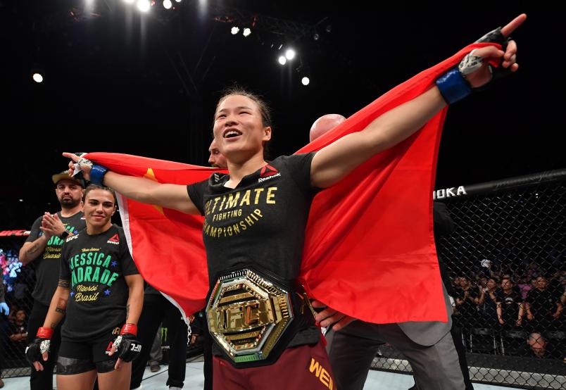 SHENZHEN, CHINA - AUGUST 31: Zhang Weili of China celebrates after her knockout victory over Jessica Andrade of Brazil in their UFC strawweight championship bout during the UFC Fight Night event at Shenzhen Universiade Sports Centre on August 31, 2019 in Shenzhen, China. (Photo by Brandon Magnus/Zuffa LLC)