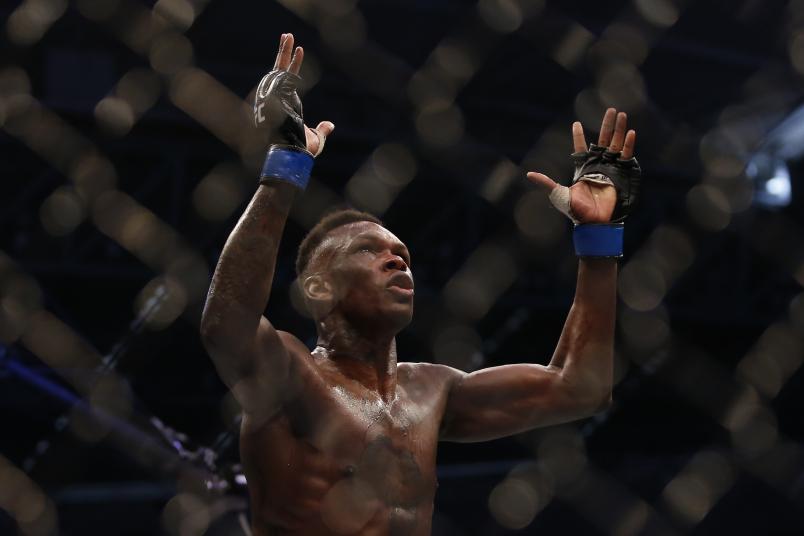 MELBOURNE, AUSTRALIA - OCTOBER 06: Israel Adesanya celebrates his victory over Robert Whittaker between in their Middleweight title bout during UFC 243 at Marvel Stadium on October 06, 2019 in Melbourne, Australia. (Photo by Darrian Traynor/Getty Images)