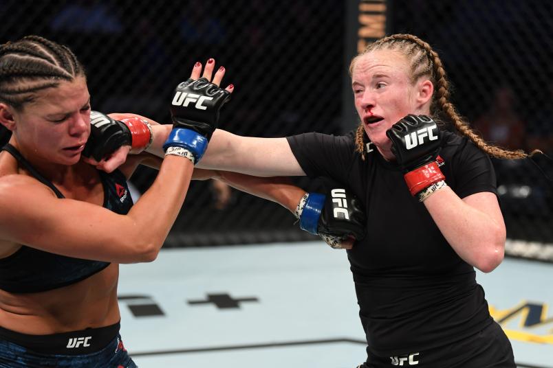 TAMPA, FLORIDA - OCTOBER 12: (R-L) JJ Aldrich punches Lauren Mueller in their women's flyweight bout during the UFC Fight Night event at Amalie Arena on October 12, 2019 in Tampa, Florida. (Photo by Josh Hedges/Zuffa LLC via Getty Images)