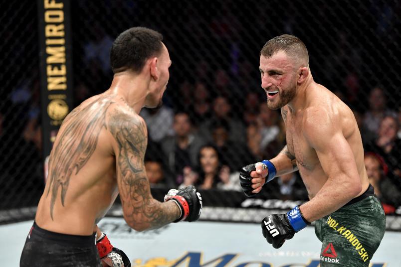 LAS VEGAS, NEVADA - DECEMBER 14: (L-R) Alexander Volkanovski of Australia eyes Max Holloway in their UFC featherweight championship bout during the UFC 245 event at T-Mobile Arena on December 14, 2019 in Las Vegas, Nevada. (Photo by Jeff Bottari/Zuffa LLC)
