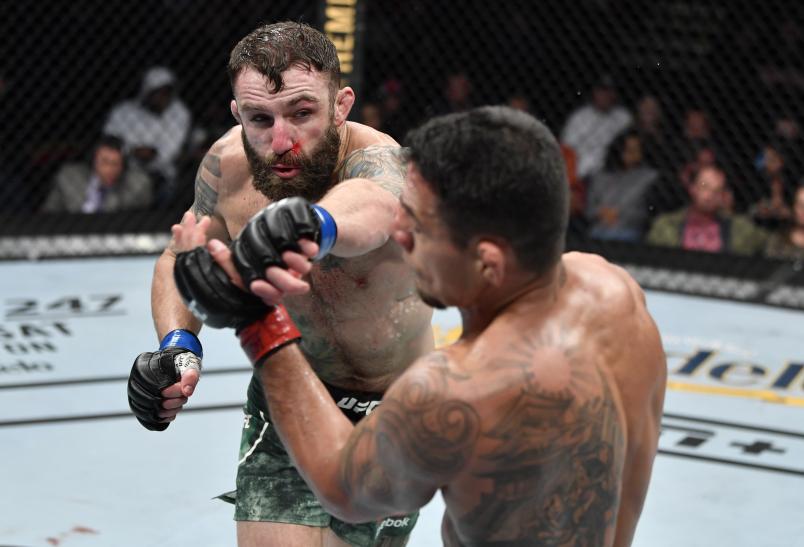 RALEIGH, NORTH CAROLINA - JANUARY 25: (L-R) Michael Chiesa punches Rafael Dos Anjos of Brazil in their welterweight fight during the UFC Fight Night event at PNC Arena on January 25, 2020 in Raleigh, North Carolina. (Photo by Jeff Bottari/Zuffa LLC via Getty Images)