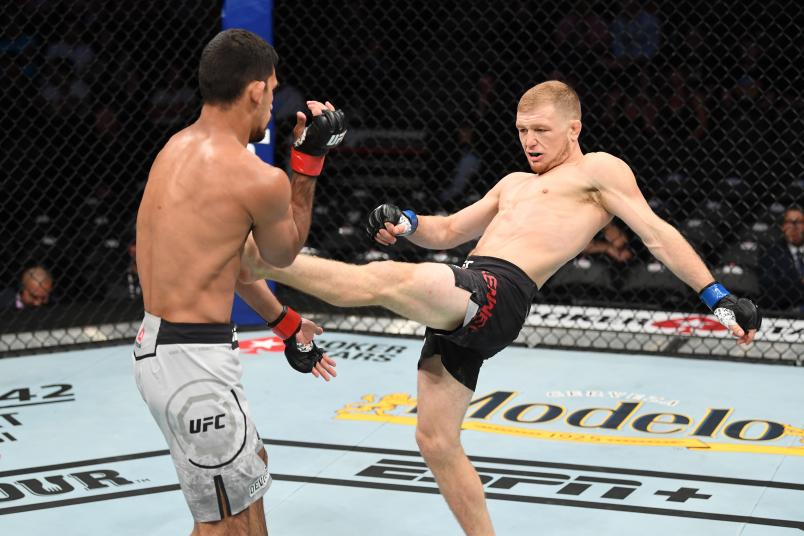 ANAHEIM, CALIFORNIA - AUGUST 17: (R-L) Casey Kenney kicks Manny Bermudez in their catchweight bout during the UFC 241 event at the Honda Center on August 17, 2019 in Anaheim, California. (Photo by Josh Hedges/Zuffa LLC)