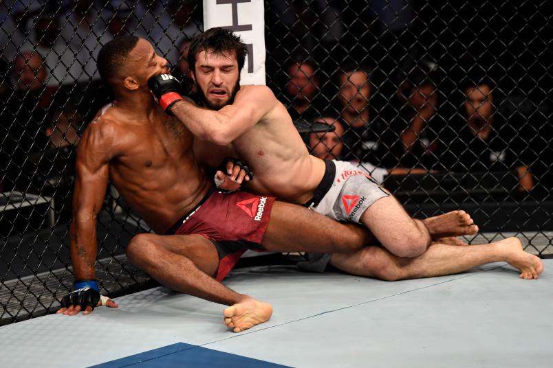 ABU DHABI, UNITED ARAB EMIRATES - SEPTEMBER 07: (R-L) Zubaira Tukhugov of Russia punches Lerone Murphy of United Kingdom in their featherweight bout during UFC 242 at The Arena on September 7, 2019 in Yas Island, Abu Dhabi, United Arab Emirates. (Photo by Jeff Bottari/Zuffa LLC)