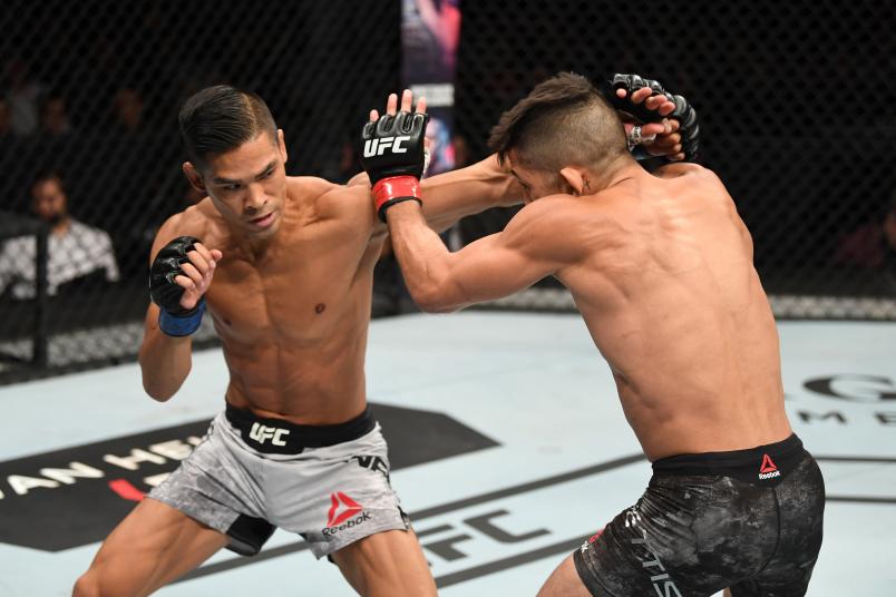 MEXICO CITY, MEXICO - SEPTEMBER 21: (L-R) Tyson Nam punches Sergio Pettis in their flyweight bout during the UFC Fight Night event on September 21, 2019 in Mexico City, Mexico. (Photo by Josh Hedges/Zuffa LLC/Zuffa LLC via Getty Images)