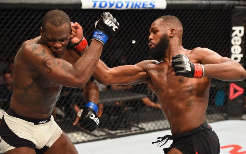 Jon Jones punches Ovince Saint Preux in their interim UFC light heavyweight championship bout during the UFC 197 event inside MGM Grand Garden Arena on April 23, 2016 in Las Vegas, Nevada. (Photo by Josh Hedges/Zuffa LLC via Getty Images)