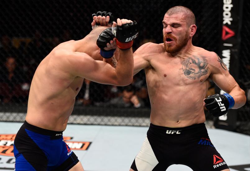 VANCOUVER, BC - AUGUST 27: (R-L) Jim Miller of the United States punches Joe Lauzon of the United States in their lightweight bout during the UFC Fight Night event at Rogers Arena on August 27, 2016 in Vancouver, British Columbia, Canada. (Photo by Jeff Bottari/Zuffa LLC)
