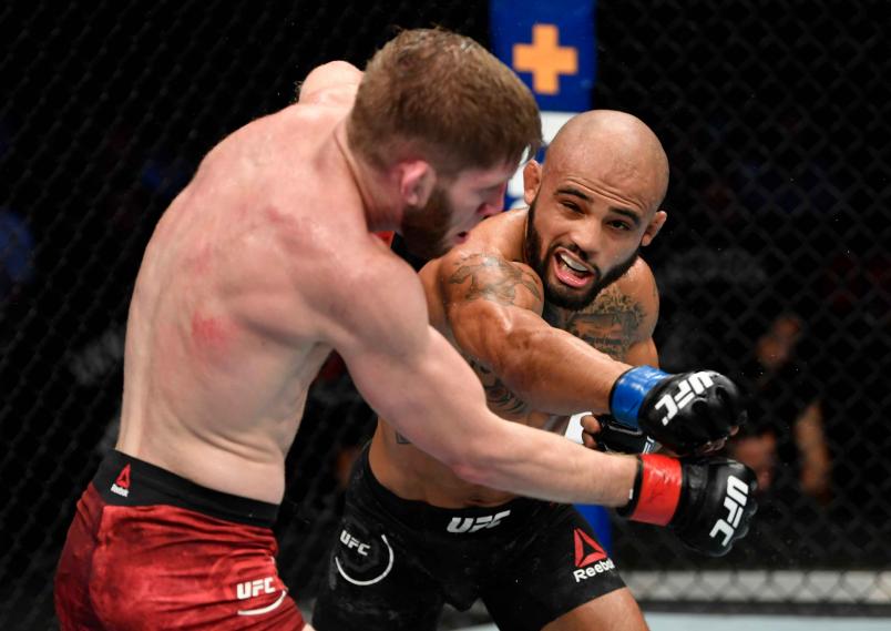 Miles Johns punches Cole Smith in their bantamweight bout during the UFC Fight Night event at Rogers Arena on September 14, 2019 in Vancouver, Canada. (Photo by Jeff Bottari/Zuffa LLC/Zuffa LLC)