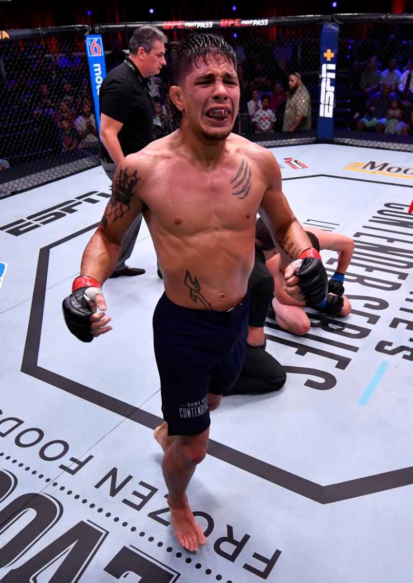 TJ Brown celebrates after his submission win over Dylan Lockard in their featherweight bout during Dana White's Contender Series season three week 10 at the UFC Apex on August 27, 2019 in Las Vegas, Nevada. (Photo by Jeff Bottari/DWCS LLC/Zuffa LLC)
