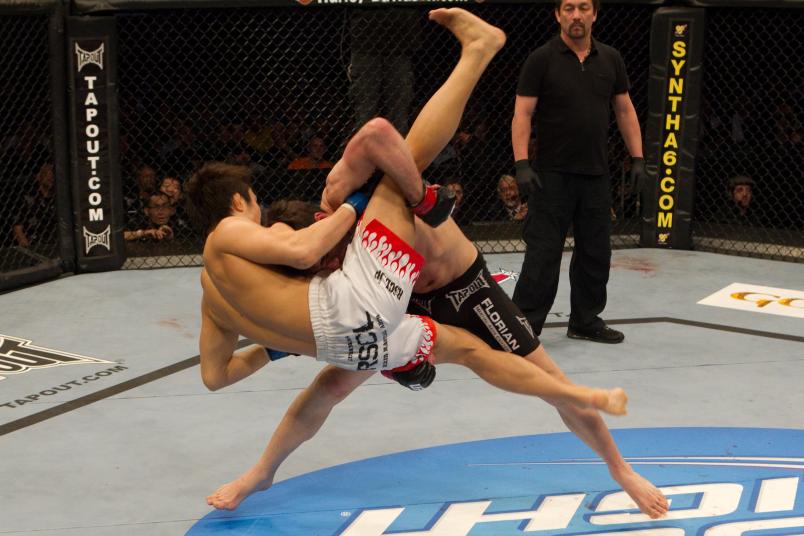 CHARLOTTE, NC - MARCH 31: Kenny Florian (black shorts) def. Takanori Gomi (white/flame shorts) - Submission (rear naked choke) - 2:52 round 3 during UFC Fight Night 21 at Bojangles Coliseum on March 31, 2010 in Charlotte, North Carolina. (Photo by Josh Hedges/Zuffa LLC via Getty Images)