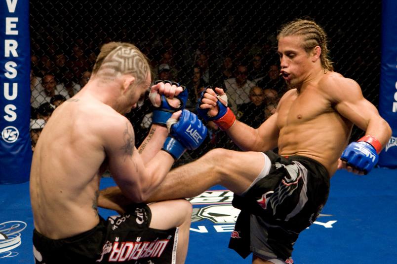 SACRAMENTO, CA - JUNE 01: (R-L) Urijah Faber kicks Jens Pulver at WEC 34 on June 1, 2008 in Sacramento, California. (Photo by Josh Hedges/Zuffa LLC/Zuffa LLC via Getty Images)