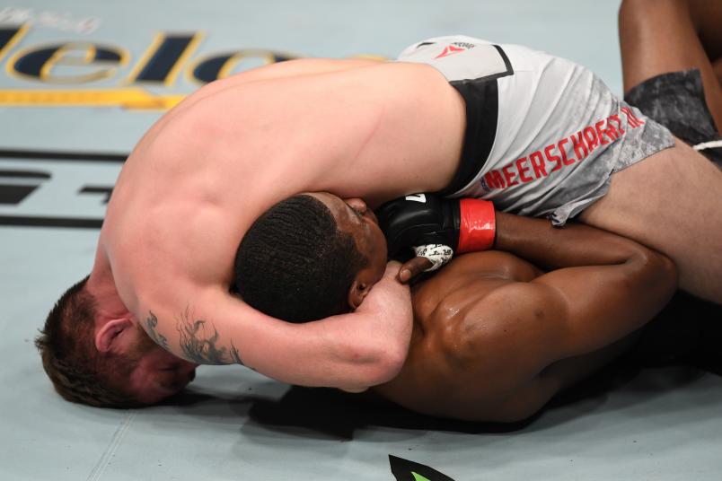 PHILADELPHIA, PA - MARCH 30: (L-R) Gerald Meerschaert attempts to submit Kevin Holland in their middleweight bout during the UFC Fight Night event at Wells Fargo Center on March 30, 2019 in Philadelphia, Pennsylvania. (Photo by Josh Hedges/Zuffa LLC/Zuffa LLC via Getty Images)