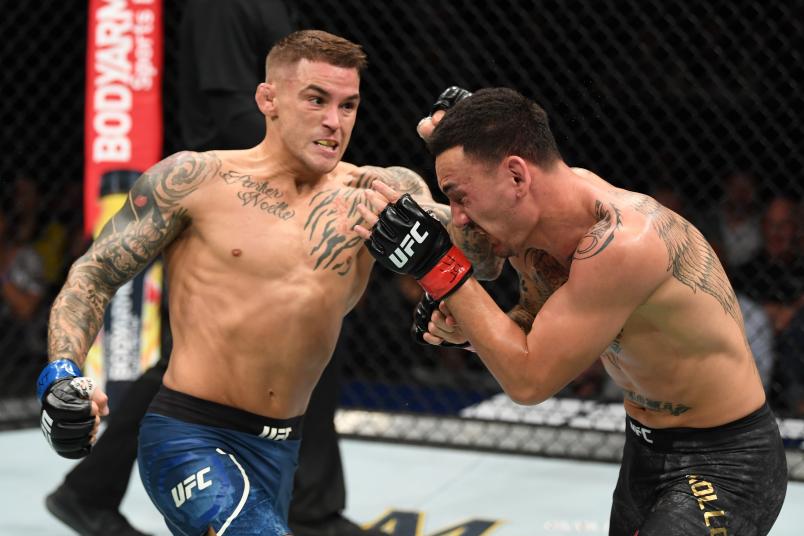 Dustin Poirier punches Max Holloway in their interim lightweight championship bout during the UFC 236 event at State Farm Arena on April 13, 2019 in Atlanta, Georgia. (Photo by Josh Hedges/Zuffa LLC via Getty Images)