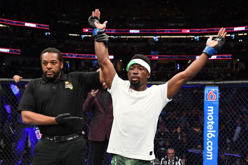 ANAHEIM, CALIFORNIA - AUGUST 17: Sodiq Yusuff of Nigeria celebrates his TKO victory over Gabriel Benitez of Mexico in their featherweight bout during the UFC 241 event at the Honda Center on August 17, 2019 in Anaheim, California. (Photo by Josh Hedges/Zuffa LLC)