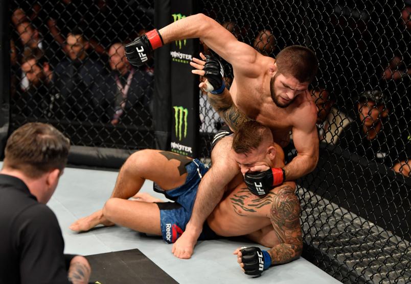 Khabib Nurmagomedov of Russia (top) punches Dustin Poirier in their lightweight championship bout during UFC 242 at The Arena on September 7, 2019 in Yas Island, Abu Dhabi, United Arab Emirates. (Photo by Jeff Bottari/Zuffa LLC via Getty Images)