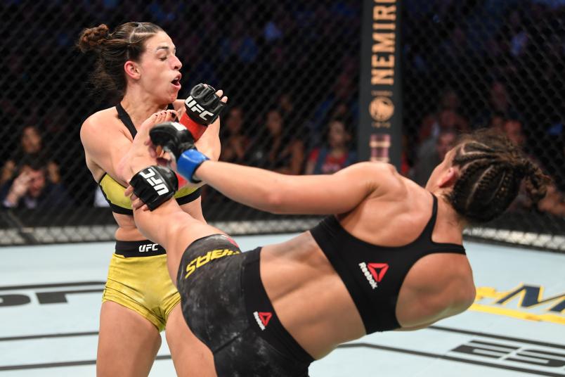 TAMPA, FLORIDA - OCTOBER 12: (R-L) Amanda Ribas of Brazil kicks Mackenzie Dern in their women's strawweight bout during the UFC Fight Night event at Amalie Arena on October 12, 2019 in Tampa, Florida. (Photo by Josh Hedges/Zuffa LLC via Getty Images)