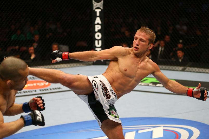 MONTREAL, QC - MARCH 16: T.J. Dillashaw kicks Issei Tamura in their bantamweight bout during the UFC 158 event at Bell Centre on March 16, 2013 in Montreal, Quebec, Canada. (Photo by Jonathan Ferrey/Zuffa LLC/Zuffa LLC via Getty Images)