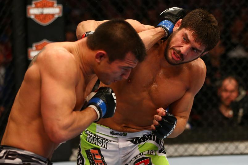 MONTREAL, QC - MARCH 16: (R-L) Patrick Cote lands a punch on Bobby Voelker in their welterweight bout during the UFC 158 event at Bell Centre on March 16, 2013 in Montreal, Quebec, Canada. (Photo by Jonathan Ferrey/Zuffa LLC/Zuffa LLC via Getty Images)