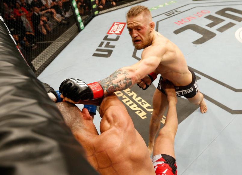 DUBLIN, IRELAND - JULY 19: (R-L) Conor McGregor lands a left to the head of Diego Brandao in their featherweight bout during the UFC Fight Night event at The O2 Dublin on July 19, 2014 in Dublin, Ireland. (Photo by Josh Hedges/Zuffa LLC/Zuffa LLC via Getty Images)