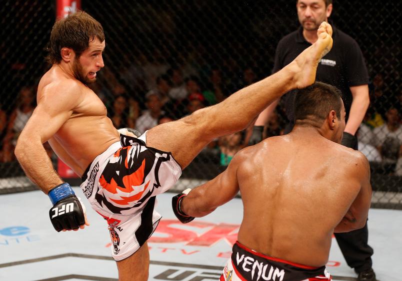 NATAL, BRAZIL - MARCH 23: (L-R) Maribek Taisumov kicks Michel Prazeres in their lightweight bout during the UFC Fight Night event at Ginasio Nelio Dias on March 23, 2014 in Natal, Brazil. (Photo by Josh Hedges/Zuffa LLC/Zuffa LLC via Getty Images)
