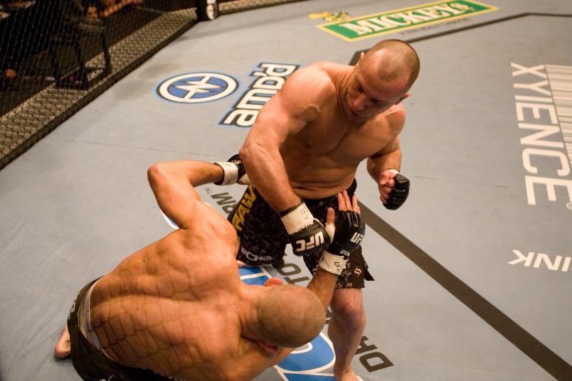 HOUSTON - APRIL 7: Matt Serra (brown/camo shorts) def. Georges St-Pierre (green shorts) - TKO - 3:25 round 1 during UFC 69 at Toyota Center on April 7, 2007 in Houston, Texas. (Photo by Josh Hedges/Zuffa LLC via Getty Images)