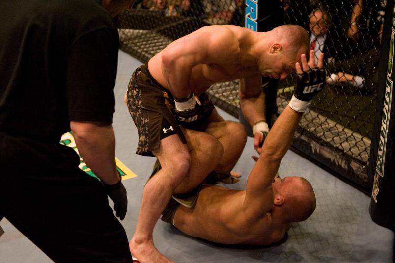 HOUSTON - APRIL 7: Matt Serra (brown/camo shorts) def. Georges St-Pierre (green shorts) - TKO - 3:25 round 1 during UFC 69 at Toyota Center on April 7, 2007 in Houston, Texas. (Photo by Josh Hedges/Zuffa LLC via Getty Images)