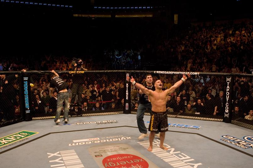 HOUSTON - APRIL 7: Matt Serra (brown/camo shorts) def. Georges St-Pierre (green shorts) - TKO - 3:25 round 1 during UFC 69 at Toyota Center on April 7, 2007 in Houston, Texas. (Photo by Josh Hedges/Zuffa LLC via Getty Images)