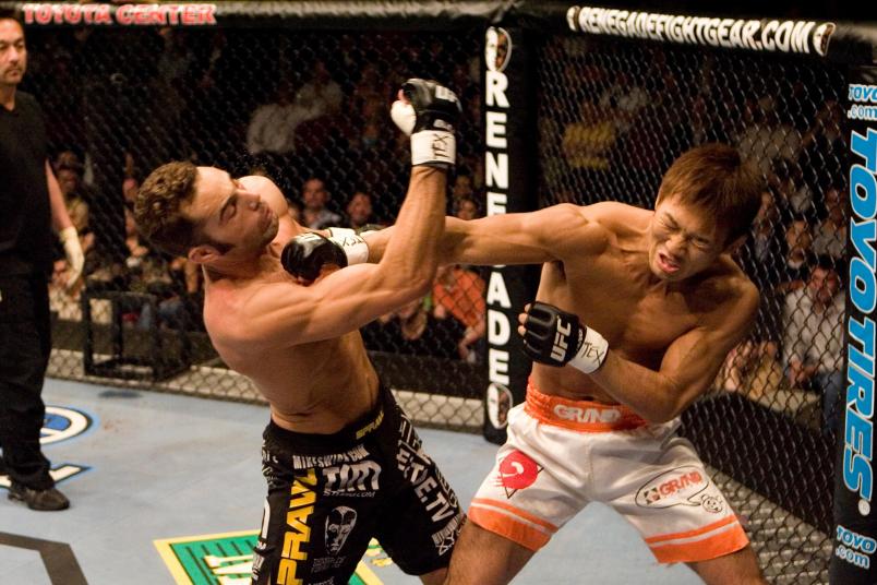 HOUSTON - APRIL 7: Yushin Okami (white shorts) def. Mike Swick (black shorts) - Unanimous Decision during UFC 69 at Toyota Center on April 7, 2007 in Houston, Texas. (Photo by Josh Hedges/Zuffa LLC via Getty Images)