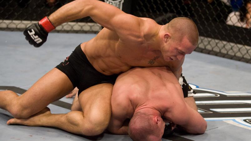 MONTREAL - APRIL 19: Georges St-Pierre (black tight shorts) def. Matt Serra (black/camo sprawl shorts) - TKO - 4:45 round 2 during the UFC 83 at Bell Centre on April,19,2008 in Montreal, Canada. (Photo by: Josh Hedges/Zuffa LLC via Getty Images)