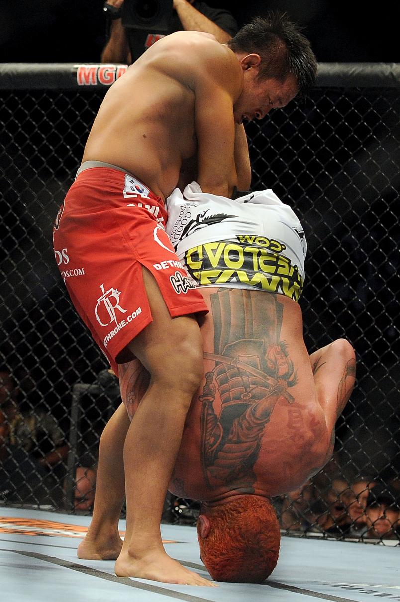 Yoshihiro Akiyama of Japan throws a right to the face of Chris Leben during the UFC middleweight bout at the MGM Grand Garden Arena on July 3, 2010 in Las Vegas, Nevada. (Photo by Jon Kopaloff/Zuffa LLC/Zuffa LLC via Getty Images)