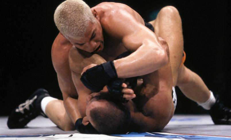 TOKYO, JAPAN - APRIL 14: Tito Ortiz (top) punches Wanderlei Silva during their Middleweight Championship bout at UFC 25 at the Yoyogi National Gymnasium on April 14, 2000 in Tokyo, Japan. (Photo by Susumu Nagao/Zuffa LLC/Zuffa LLC via Getty Images)