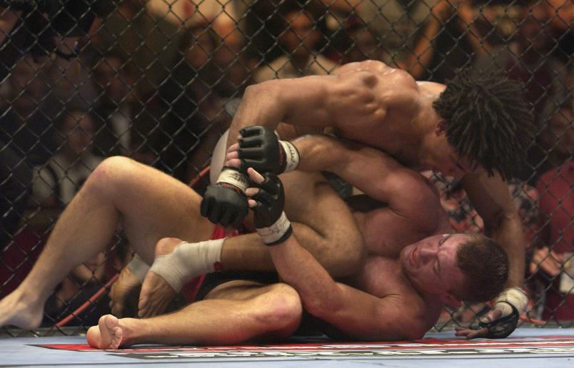 LONDON - JULY 13: Carlos Newton of Canada battles with Matt Hughes of the USA during the Ultimate Fighting Championship, "Brawl in the Royal Albert Hall", in the Royal Albert Hall London, England on July 13, 2002. (Photo by John Gichigi/Getty Images)