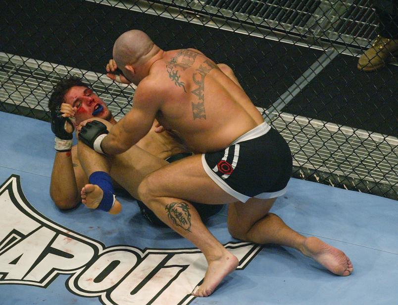 LONDON - JULY 13: Ian Freeman of Great Britain fights with Frank Mir of the USA during the Ultimate Fighting Championship, "Brawl in the Royal Albert Hall", in the Royal Albert Hall London, England on July 13, 2002. (Photo by Mike Hewitt/Getty Images)